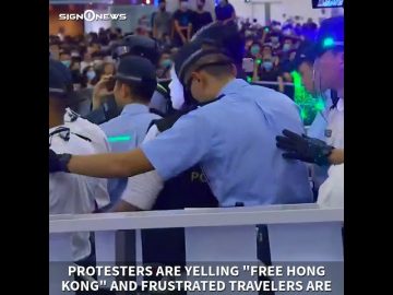 BREAKING NEWS: Passengers, riot police clash with protesters in Hong Kong